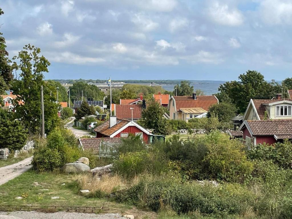 a small village with houses and a road at 4 star holiday home in Drottningskär in Drottningskär