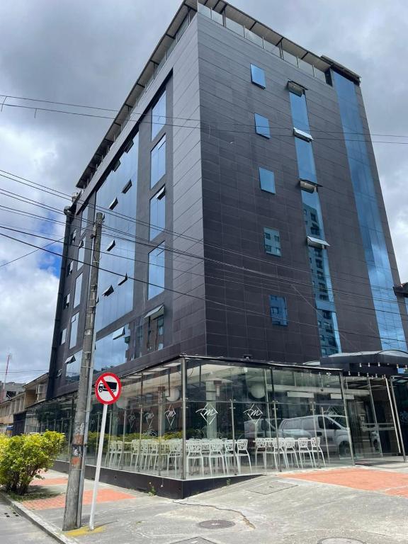 a tall black building with a lot of windows at Hotel Plaza Sport in Bogotá