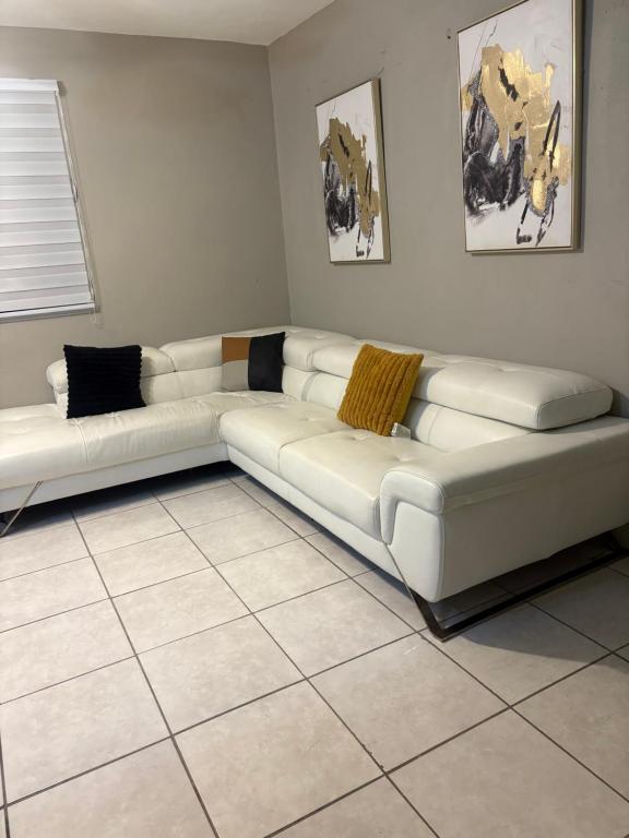 a white couch sitting in a living room at Dreamscape in Fajardo