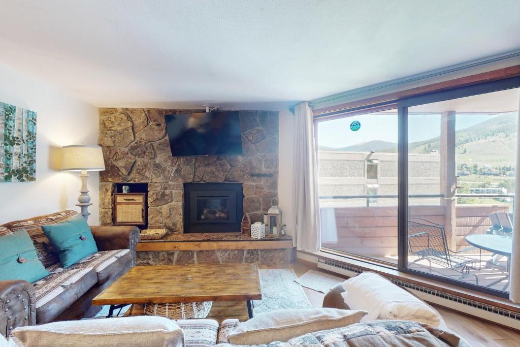 a living room with a couch and a fireplace at Marina Place 137 in Dillon
