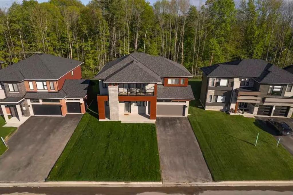an aerial view of a house with a yard at Severn Woodland in Severn