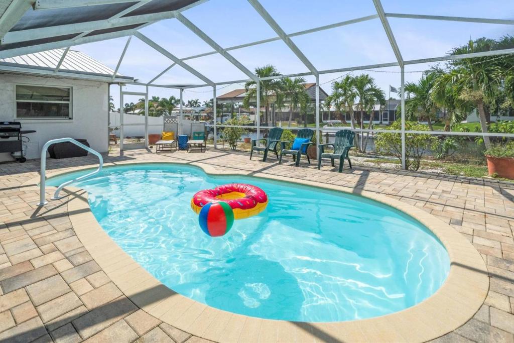 a large swimming pool with a inflatable at Pirates Den in Apollo Beach