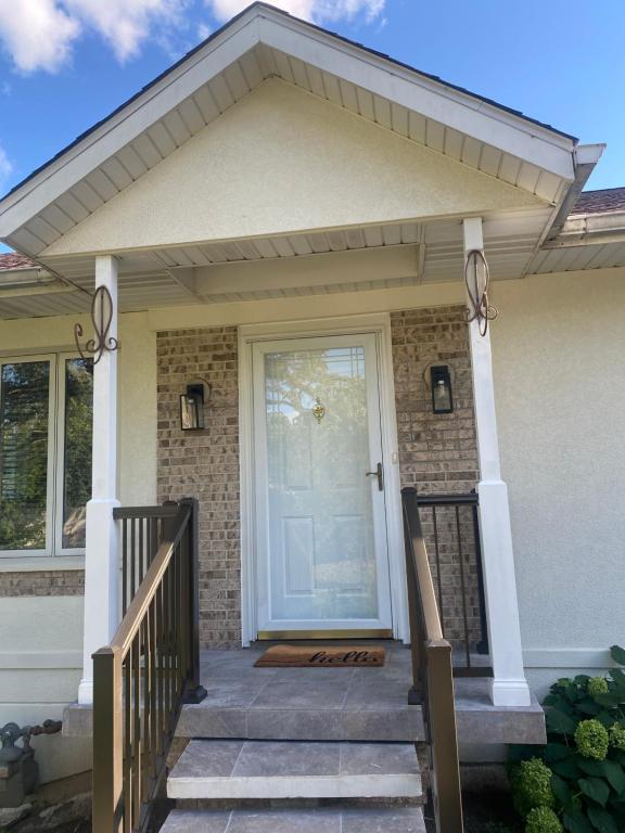 a front door of a house with a porch at Cozy Gurnee Home Near Six Flags and Base in Gurnee