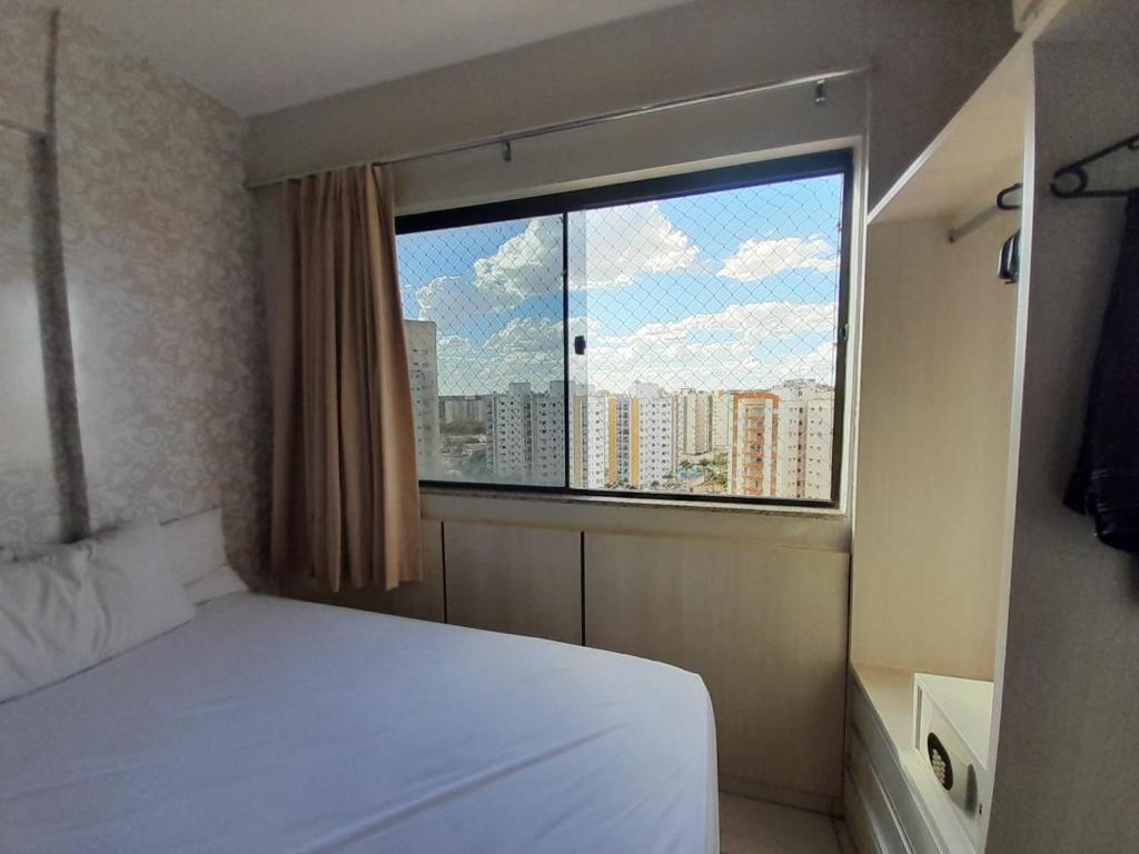 Ένα ή περισσότερα κρεβάτια σε δωμάτιο στο Golden Dolphin Supreme 1004 com cozinha ao lado do Shopping Singapura