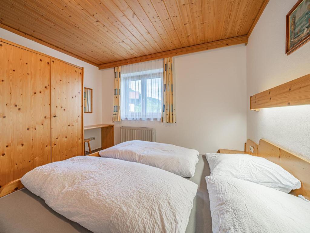 Postel nebo postele na pokoji v ubytování Kitzsteinhorn
