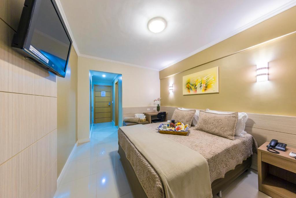 Postel nebo postele na pokoji v ubytování Hotel Thomasi Express - Londrina