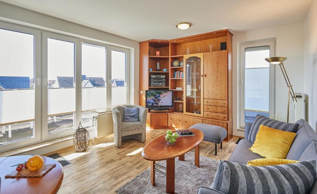 a living room with a couch and a table at Knechtsand - 441 in Cuxhaven