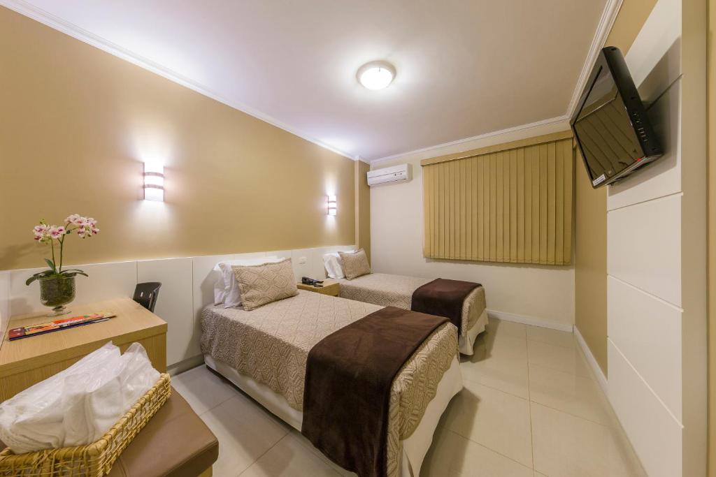 TV a/nebo společenská místnost v ubytování Hotel Thomasi Express - Londrina