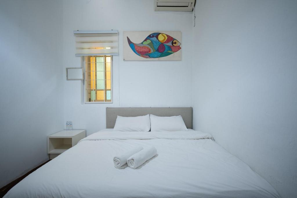 Postel nebo postele na pokoji v ubytování Moustachz Hauze , Georgetown