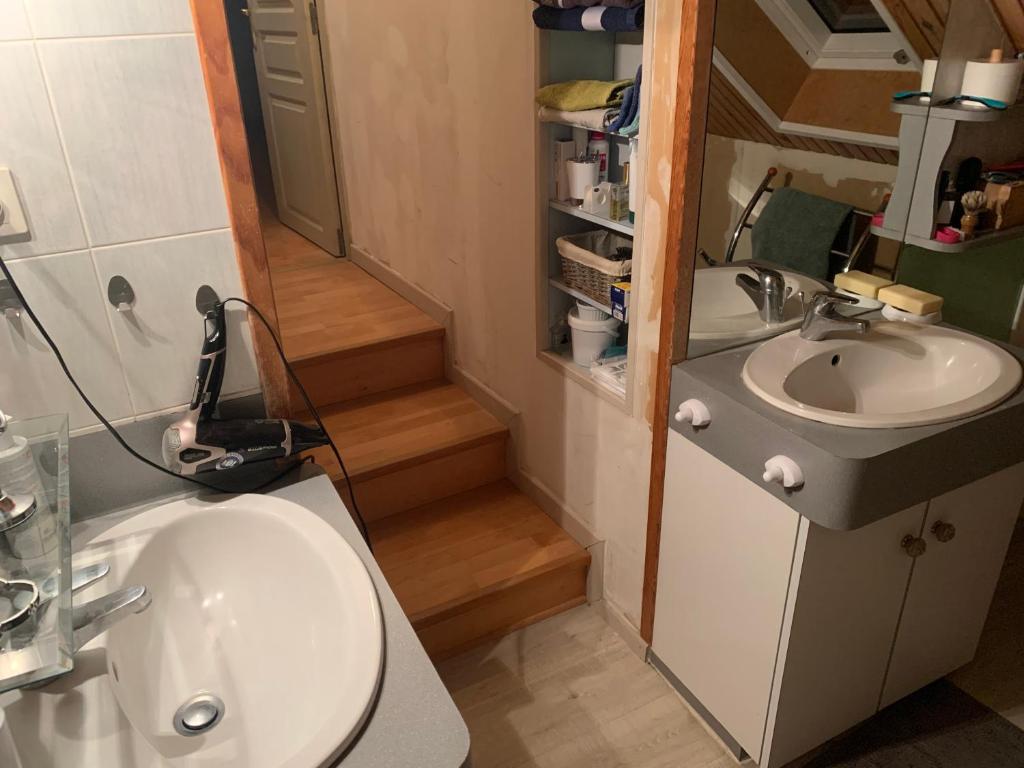 a small bathroom with a sink and a toilet at Studio 2 in Javené