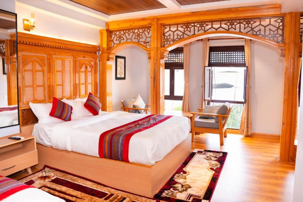 Una cama o camas en una habitación de Boudha Stupa View Guest House