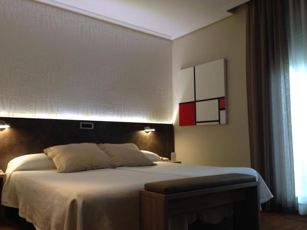 Postel nebo postele na pokoji v ubytování Hotel Oriente