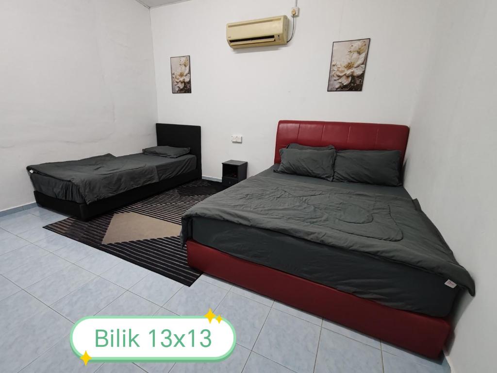 Postel nebo postele na pokoji v ubytování Rahmah Homestay Temerloh