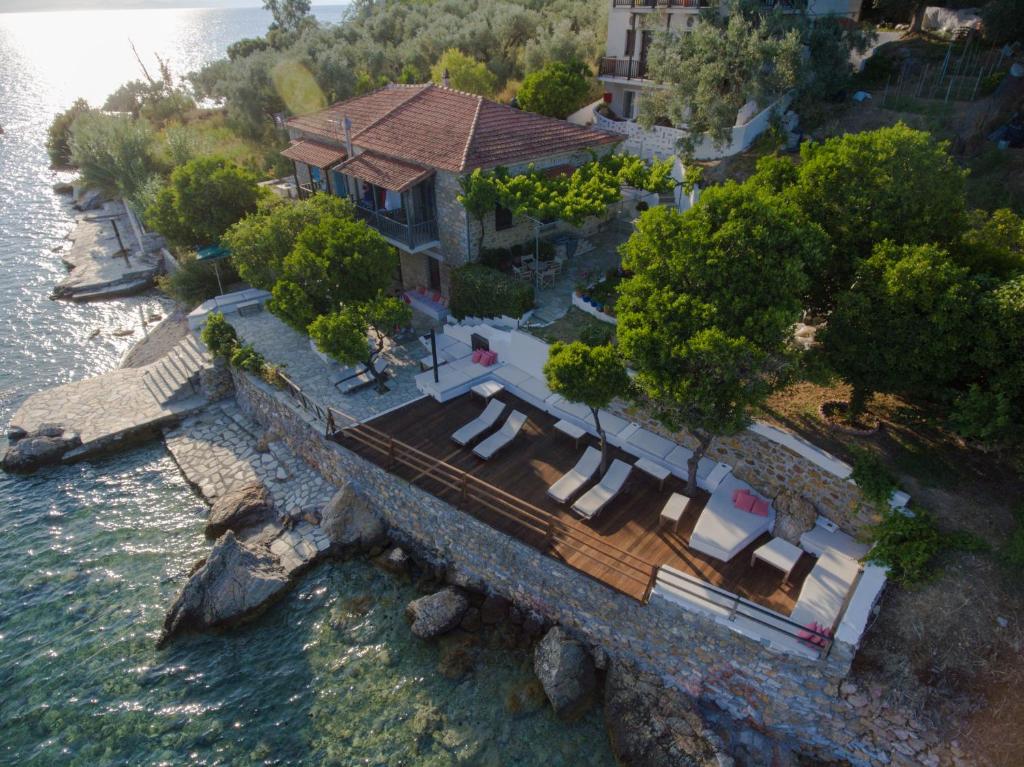 an aerial view of a house on the water at MELIES- Seaside Boutique Apartments in Chorto