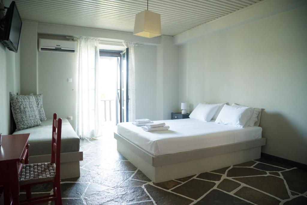Postel nebo postele na pokoji v ubytování MELIES- Seaside Boutique Apartments