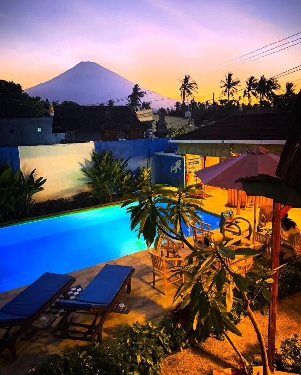 a view of a swimming pool with a mountain in the background at Alain rooms AMED in Amed
