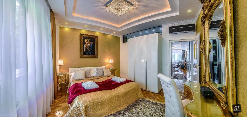 a bedroom with a bed and a mirror at BP Apartments Budapest in Budapest