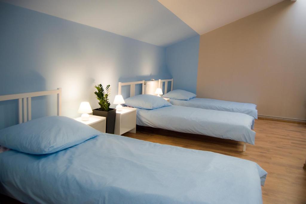Postel nebo postele na pokoji v ubytování Smart Stay Hostel Gdynia