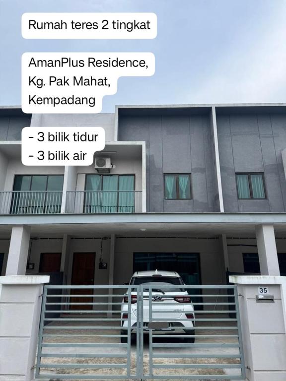 a car parked in front of a building at AzureGreen at AmanPlus Kuantan in Kuantan