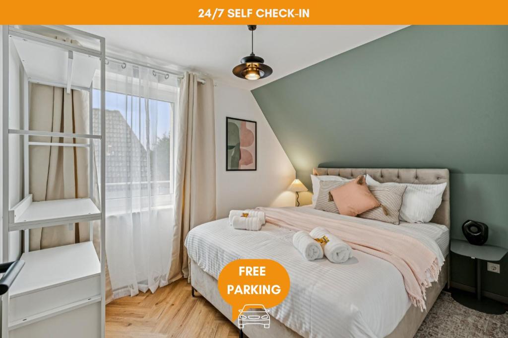 Ένα ή περισσότερα κρεβάτια σε δωμάτιο στο AT WEINMEISTER - TalPark - direkt am Kurpark und Reha-Zentrum