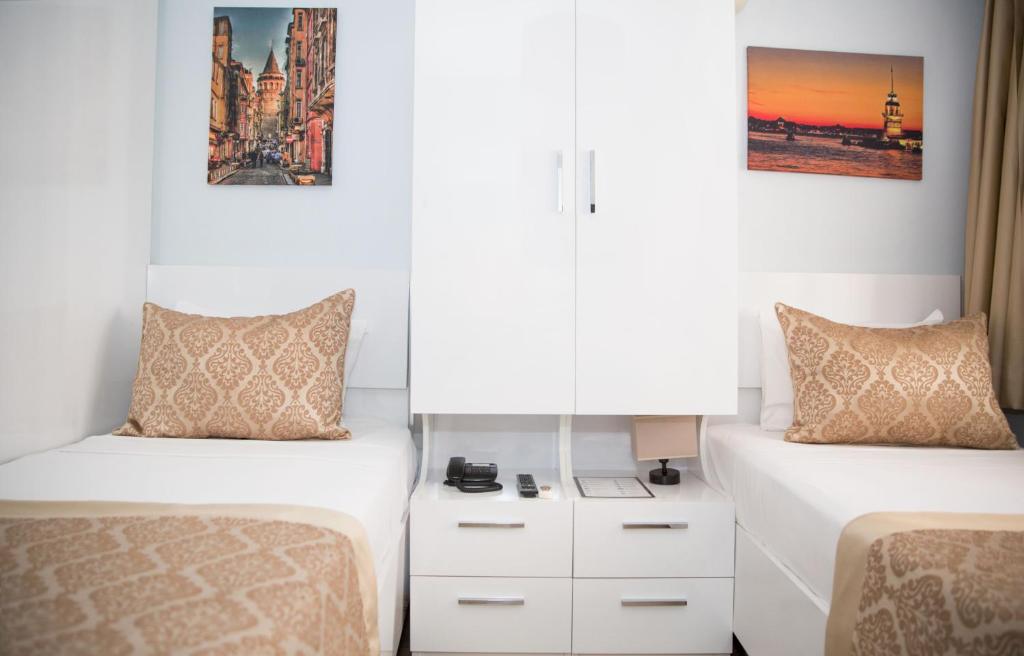 Postel nebo postele na pokoji v ubytování Lavanta Hotel