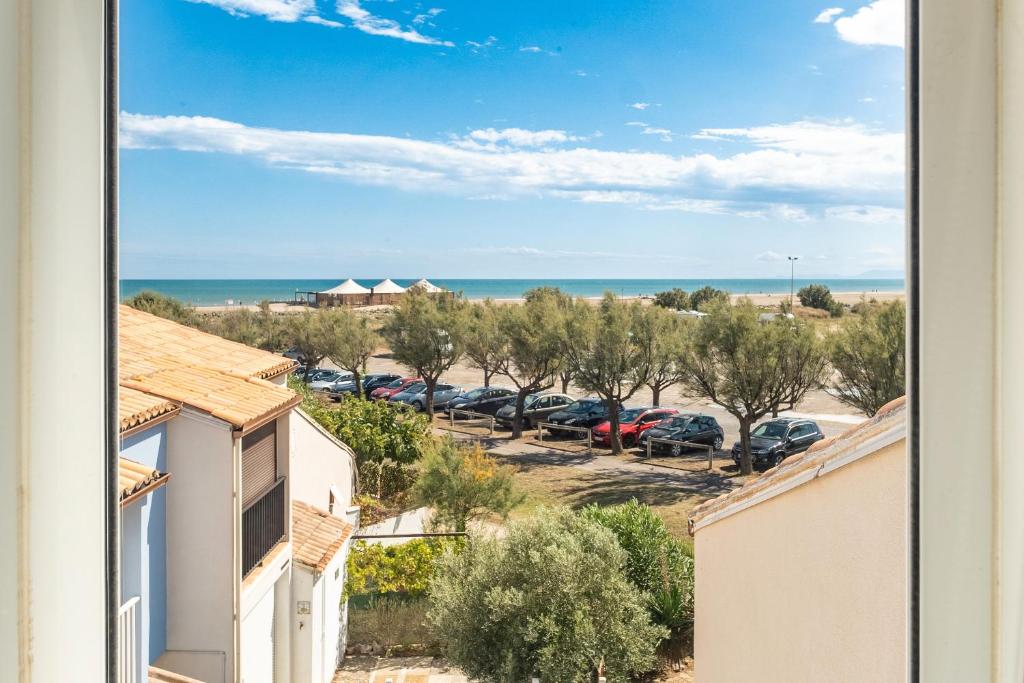 a view from a balcony of a parking lot at Les Balcons de la Méditerranée in Narbonne-Plage