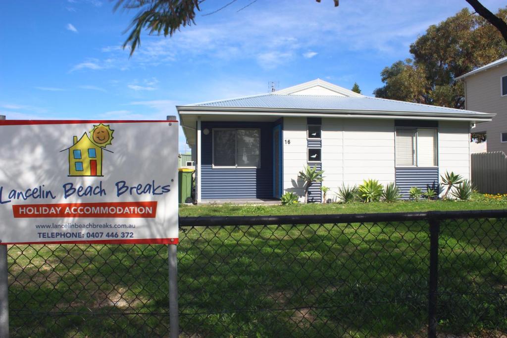 a house with a sign in front of it at Seagulls in Lancelin
