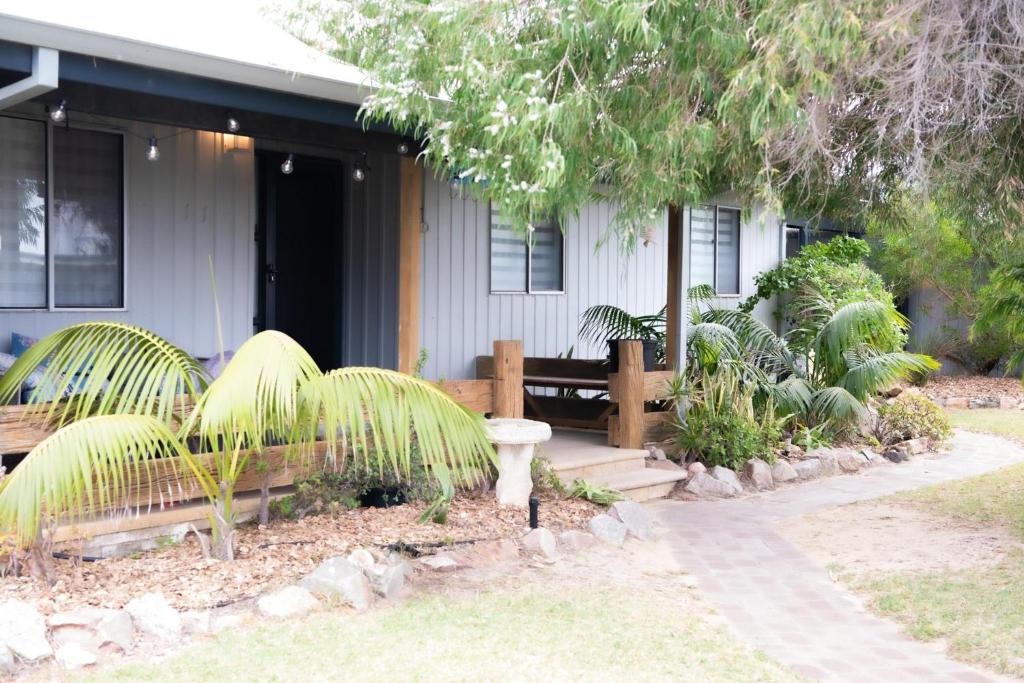 a house with a bench in front of it at Seabliss in Lancelin