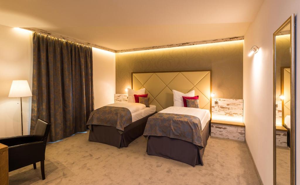 Postel nebo postele na pokoji v ubytování Hotel Allegro