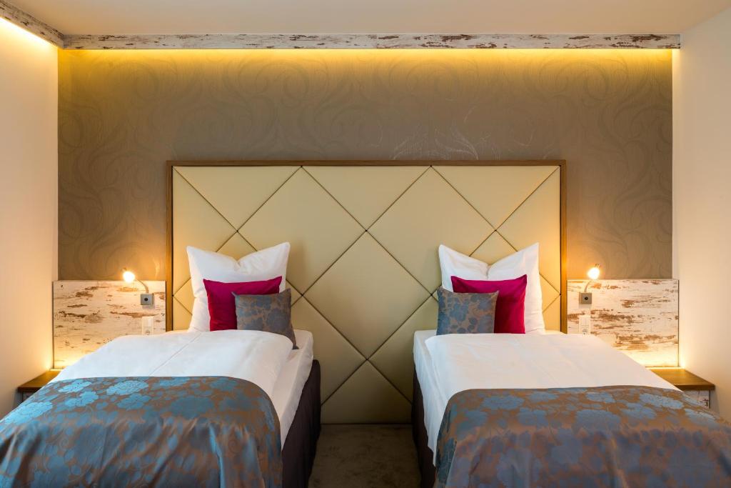 Postel nebo postele na pokoji v ubytování Hotel Allegro