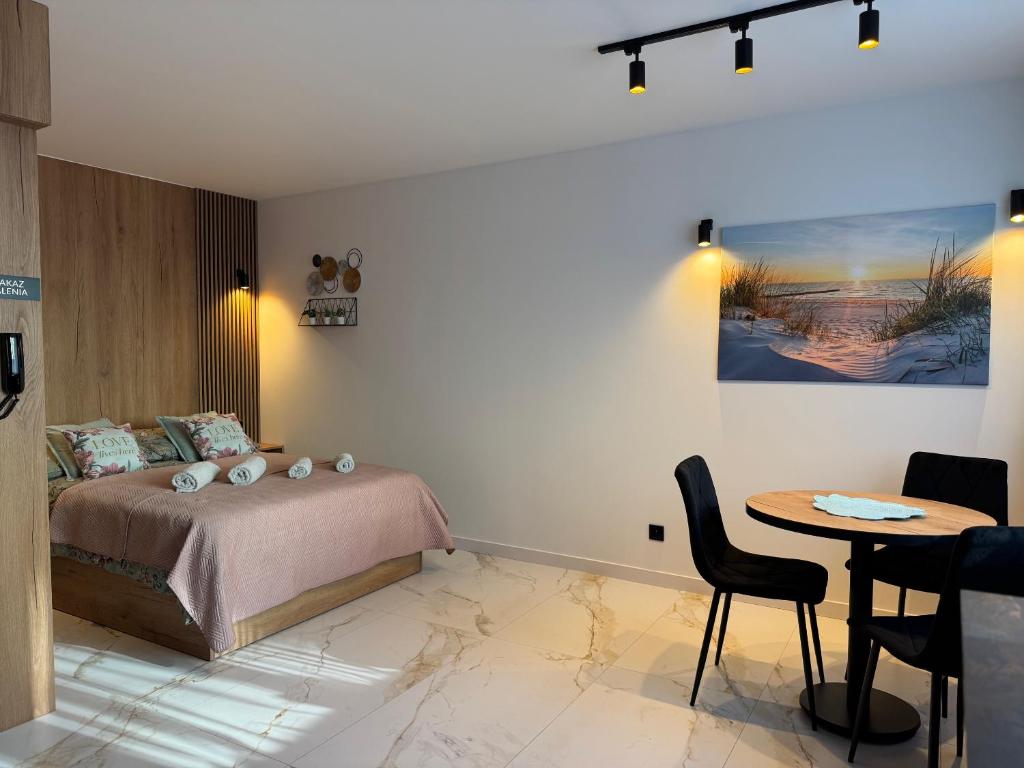 Giường trong phòng chung tại DMI Premium Apart Gdansk-Beach