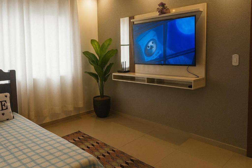 TV a/nebo společenská místnost v ubytování Casa em Campos do Jordão