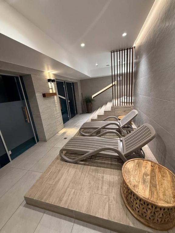 a lobby with a bunch of chairs and a table at RESORTLuxurySPA in Wrocław