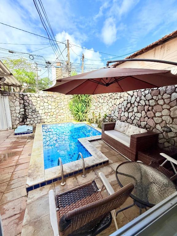 Πισίνα στο ή κοντά στο Casa na praia de boa viagem