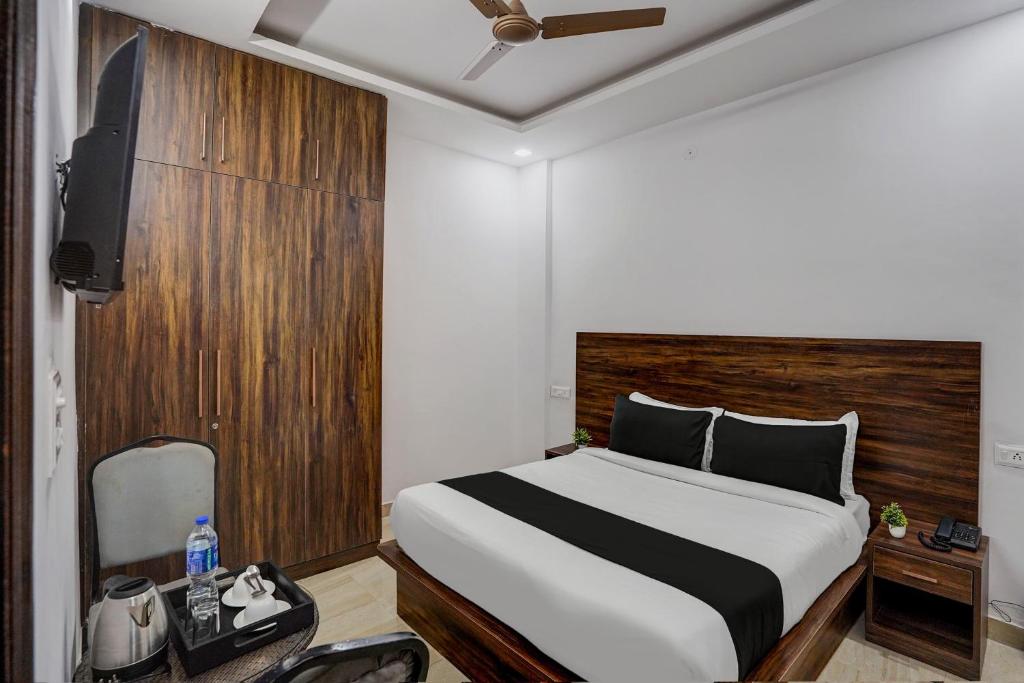 a hotel room with a bed and a television at Townhouse Cloud Bay in Gurgaon
