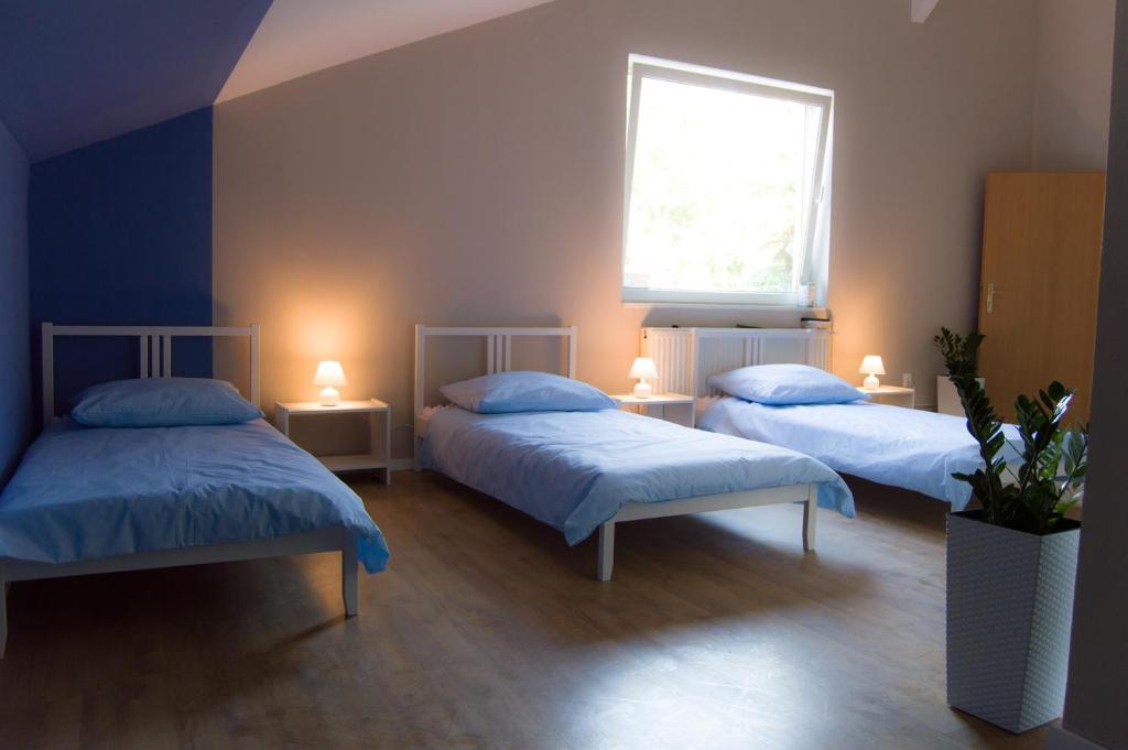 Postel nebo postele na pokoji v ubytování Smart Stay Hostel Gdynia