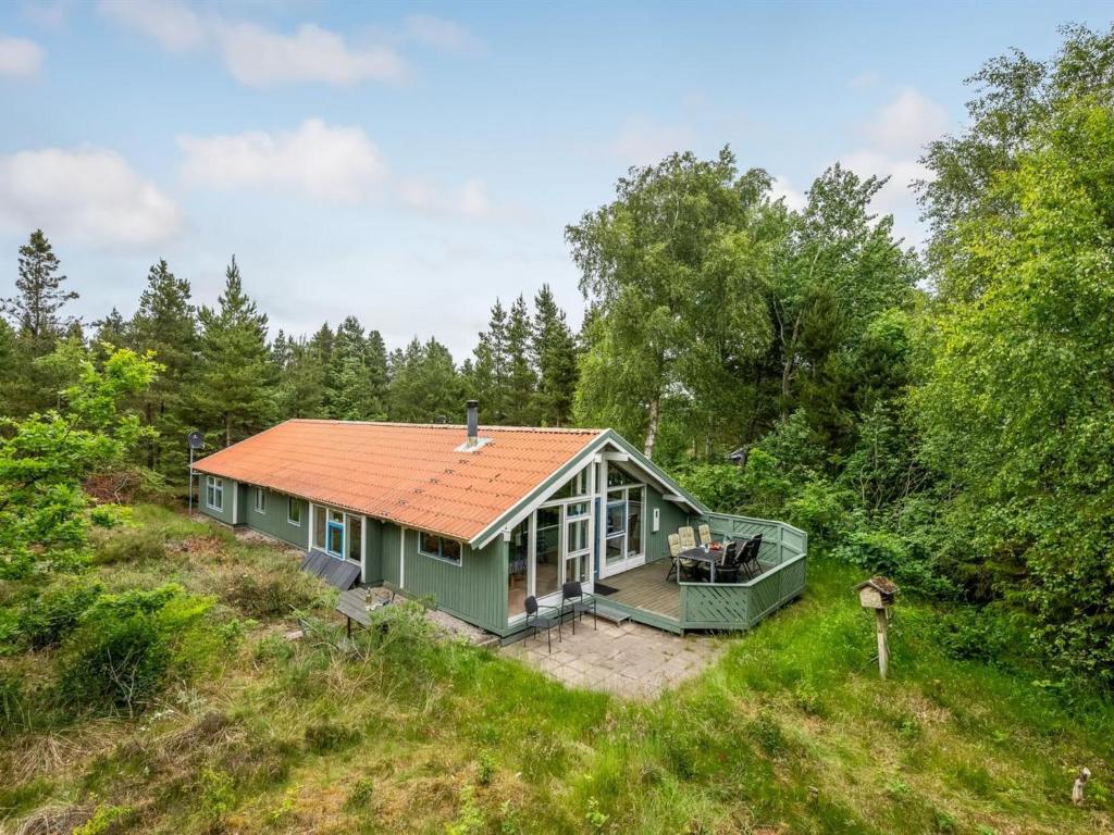 an overhead view of a green house with an orange roof at Holiday Home Aamu - 300m to the inlet by Interhome in Oksbøl
