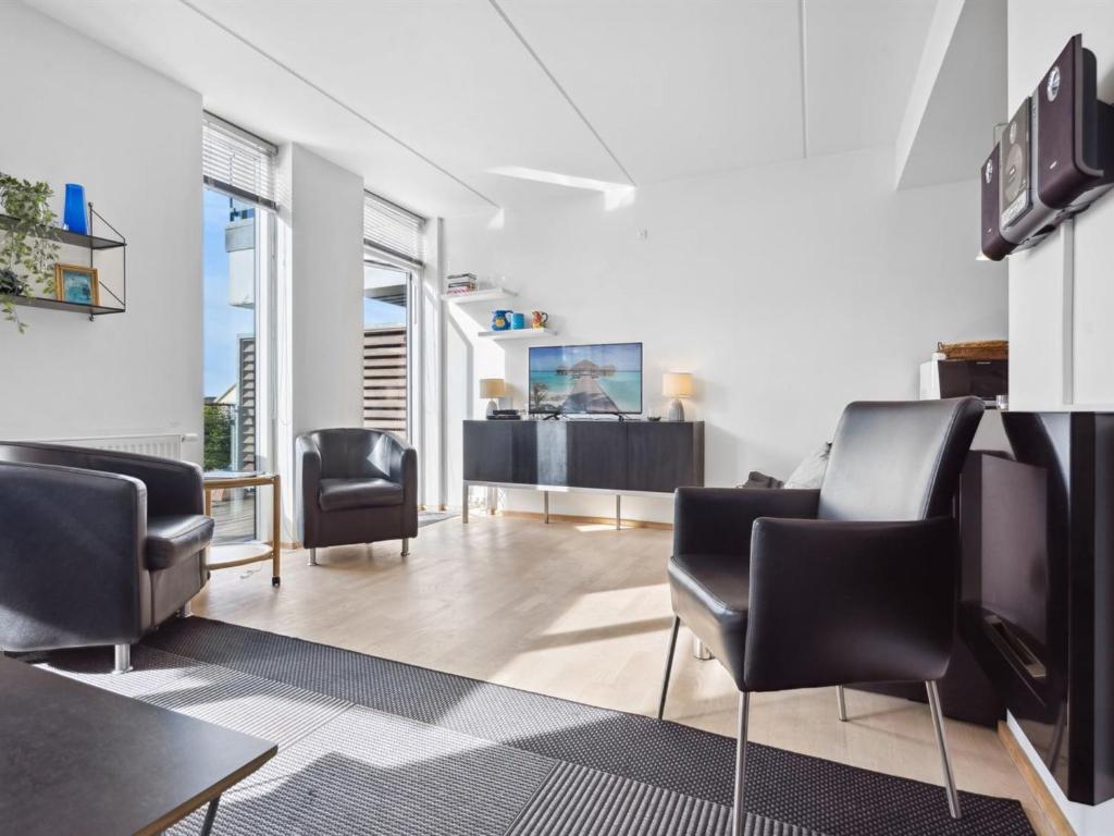 a waiting room with chairs and a table at Apartment Theis - 100m from the sea by Interhome in Havneby