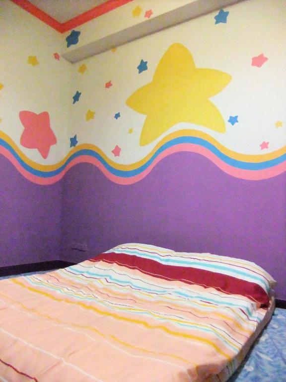 Postel nebo postele na pokoji v ubytování Sea Front Homestay