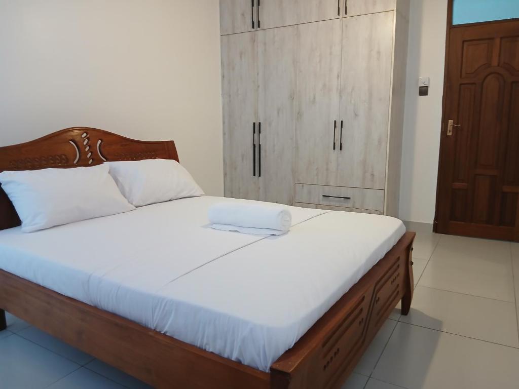 Postel nebo postele na pokoji v ubytování TAUSI RESIDENCE Nyali Mombasa