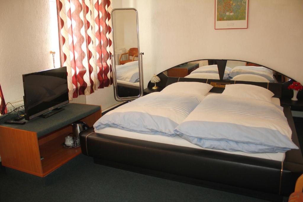 Postel nebo postele na pokoji v ubytování Hotel Restaurant Rhodos