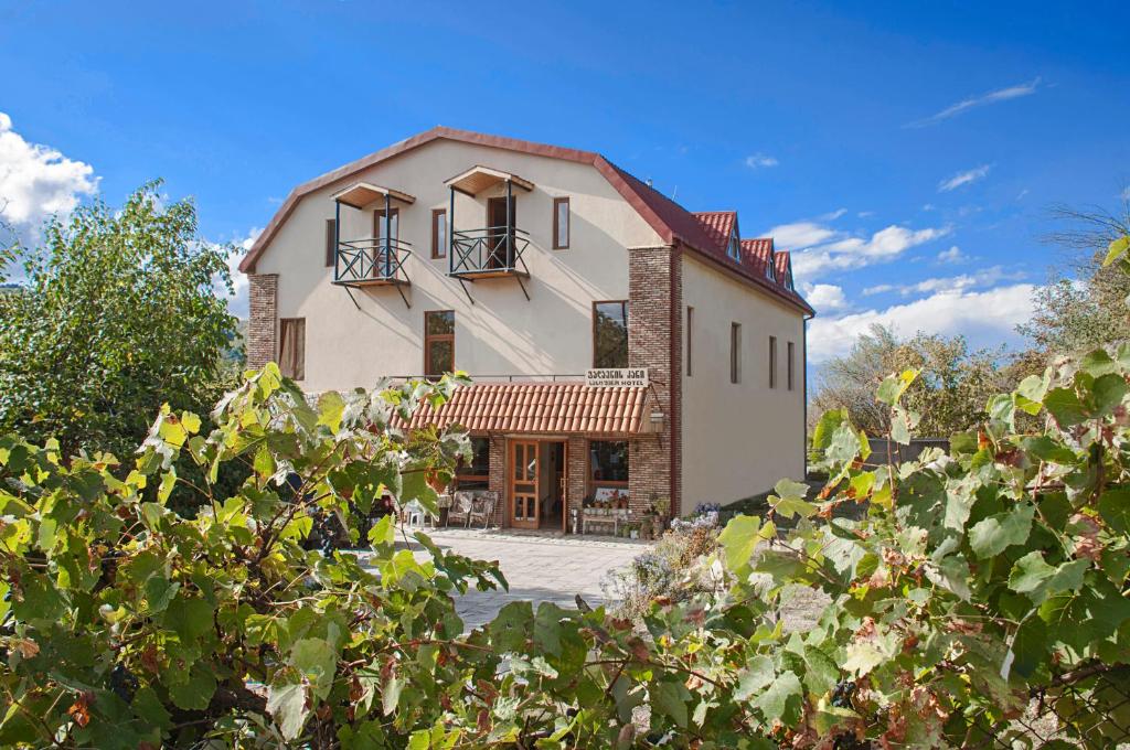 an image of a house with trees at Galavnis Kari Hotel in Sighnaghi