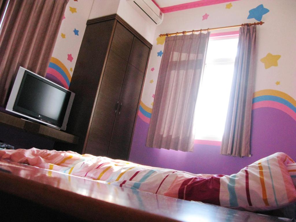 TV a/nebo společenská místnost v ubytování Sea Front Homestay