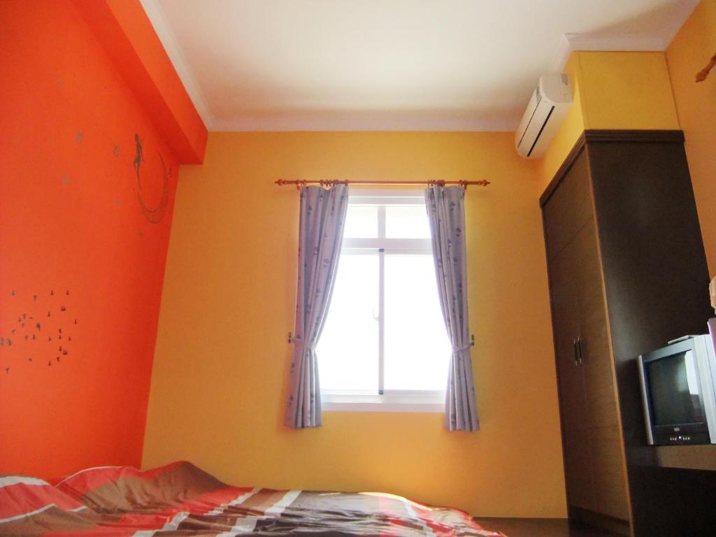 Postel nebo postele na pokoji v ubytování Sea Front Homestay