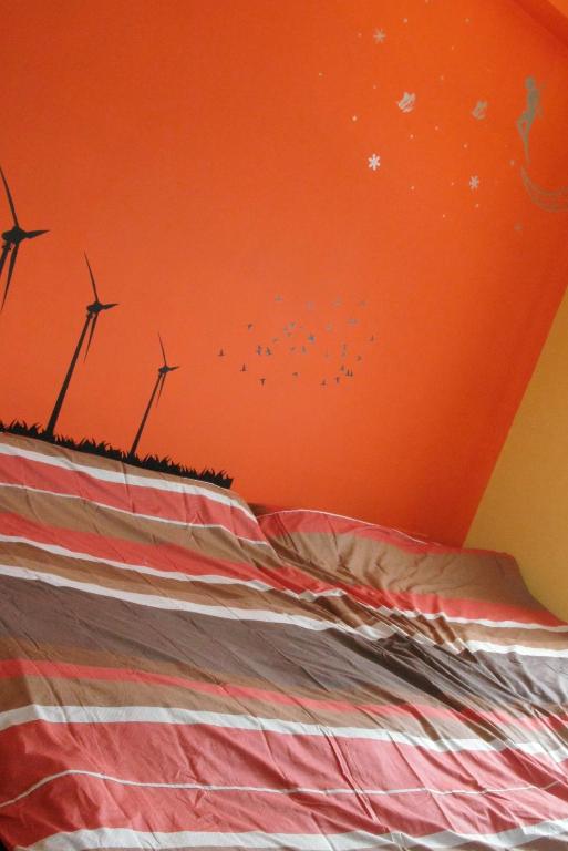 Postel nebo postele na pokoji v ubytování Sea Front Homestay