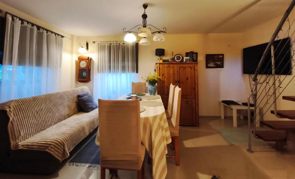 a living room with a couch and a table at Przystanek Spokój - Nowe Siodło Sudety Środkowe in Nowe Siodło