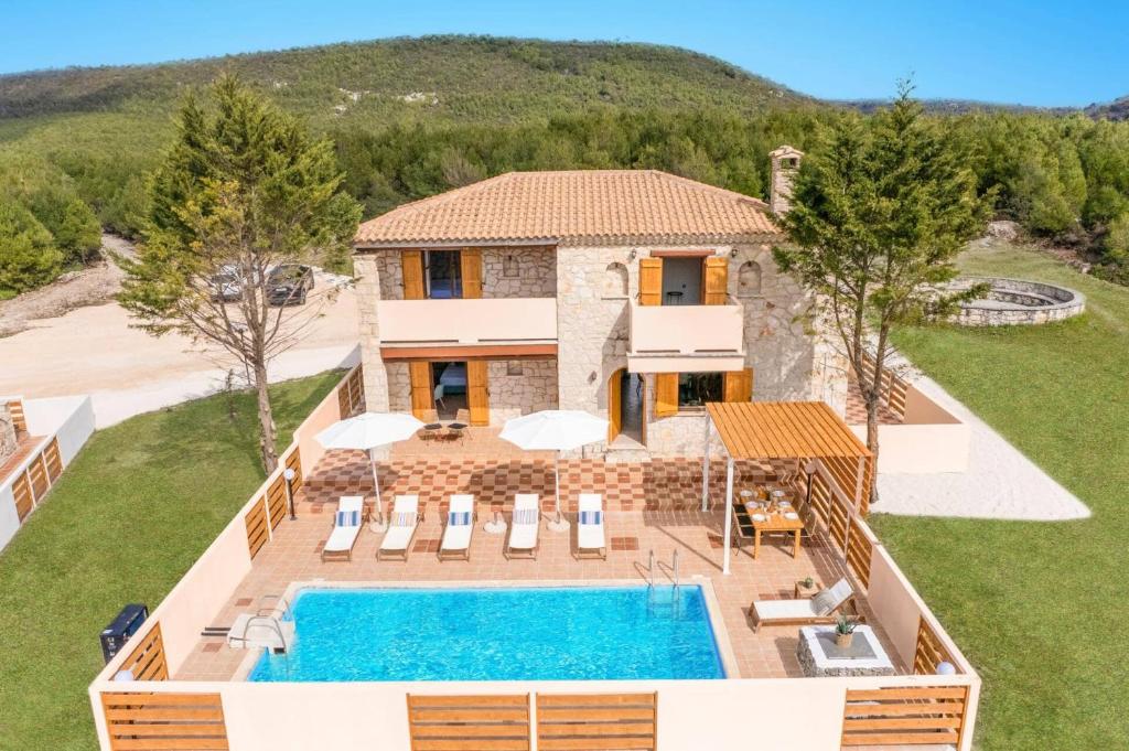 an aerial view of a villa with a swimming pool at Villa Artemisia by Villa Plus in Koiliomenos