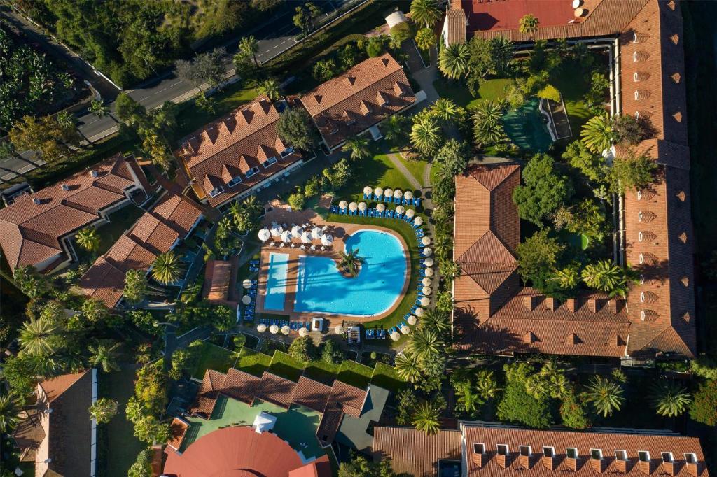 an overhead view of a resort with a swimming pool at Radisson Resort & Residences Tenerife - Adults Only in Puerto de la Cruz