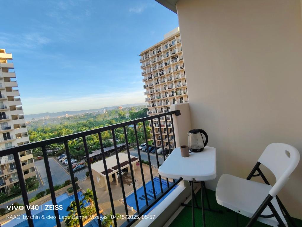 a balcony with a view of a city at Swiftie-Inspired Condo with Pool! LapuLapu Cebu in Lapu Lapu City