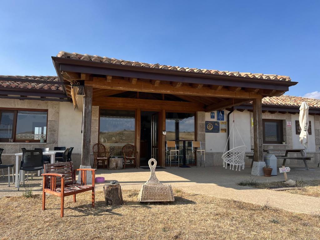 a house with a pavilion with furniture in front of it at Fuente Sidres 